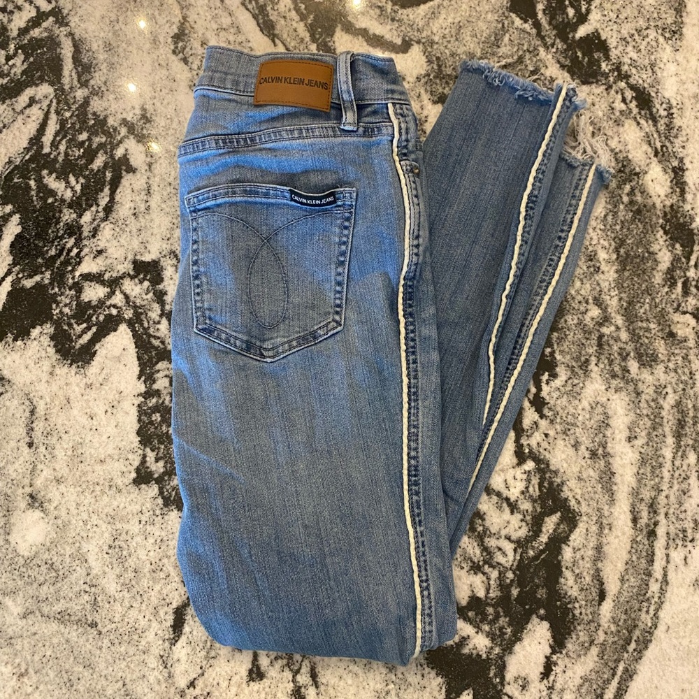 Calvin Klein jeans with white trim detail down legs